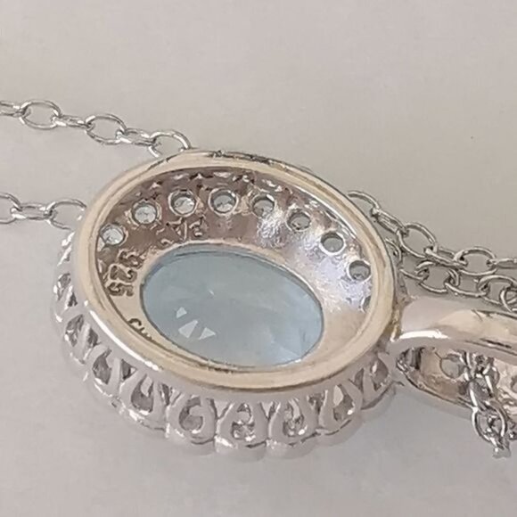 Diamond halo around Sky Blue Topaz pendant necklace - Picture 4 of 9